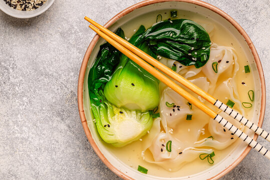 Soup with wontons and bok choy