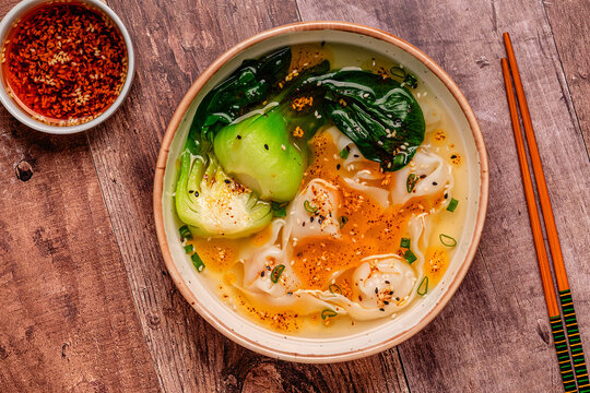 Soup with wontons and bok choy