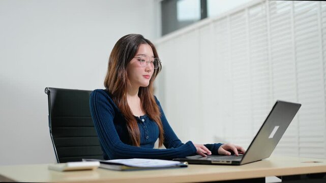 Business woman using tablet and laptop for doing math finance on an office desk, tax, report, accounting, statistics, and analytical research concept in office