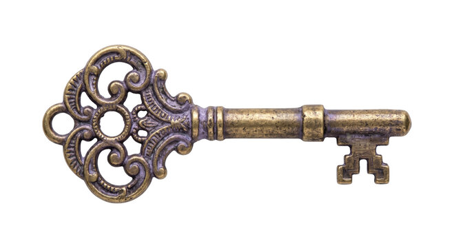 Antique ornate brass key with intricate scrollwork and a detailed bit