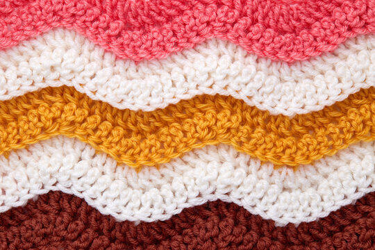 Handmade Colorful Crochet Texture Close-Up. Colorful Crocheted Background. Ripple stitch.