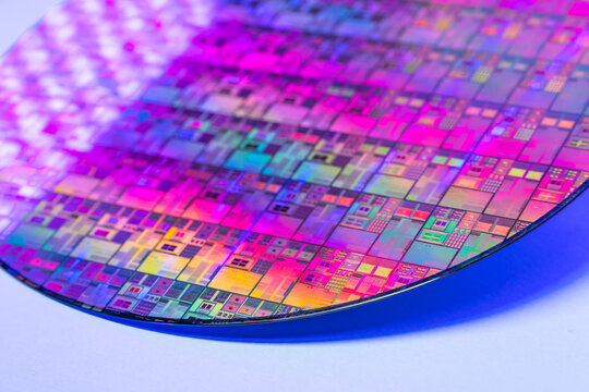 High-tech Macro Photography of a Colorful Silicon Wafer with Microchip Patterns for AI Hardware and Semiconductor Industry Concept.