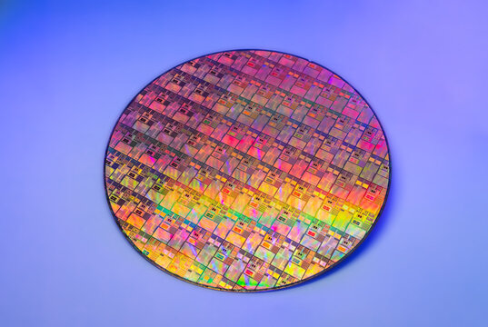 High-tech Macro Photography of a Colorful Silicon Wafer with Microchip Patterns for AI Hardware and Semiconductor Industry Concept.