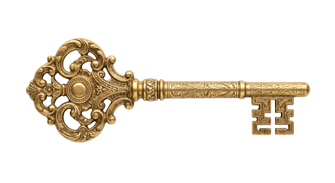 Ornate antique brass key with intricate scrollwork and detailed engravings