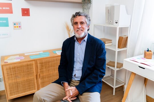 Portrait of confident business leader in modern indoor office