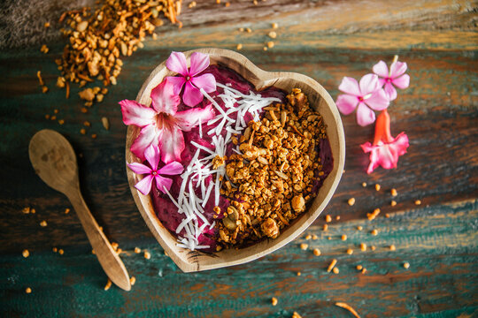 Acai Bowl with coconut flakes and pumpkin granola