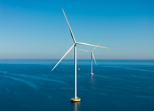 Offshore wind turbines stand in IJsselmeer lake in the Netherlands