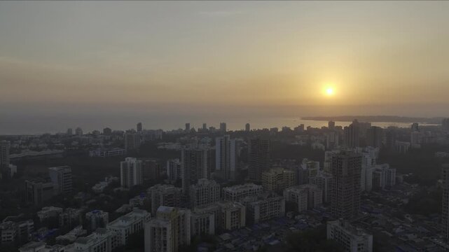  sunset above Versova coastline and high rise buildings Mumbai,
Drone shot of Versova Beach with Arabian Sea and city skyline