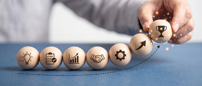 Business growth and success concept with wooden spheres representing steps to achievement, strategy, and goal attainment