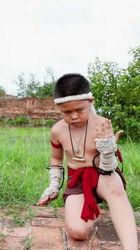 Young Thai Boxer Performs Traditional Wai Kru Ceremony at Ancient Temple