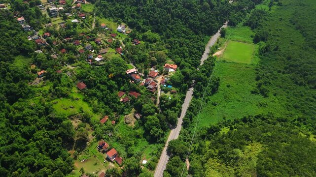 Aerial view of the living buildings surrounded by green forest. Area near the town of Paraty in Brazil