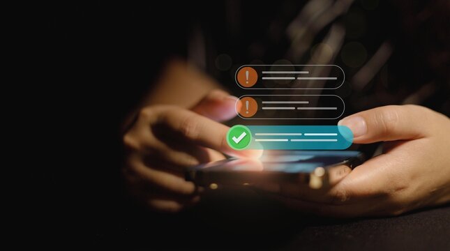 User holding smartphone with error alerts and green checkmark success notification digital interface overlay