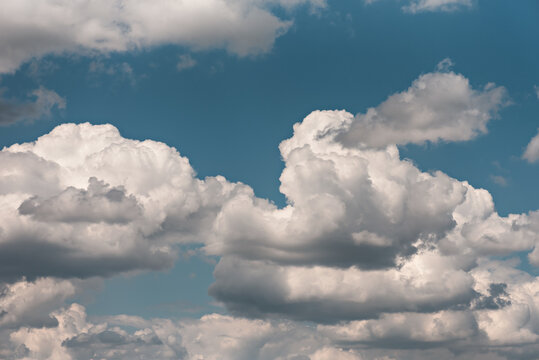 Beautiful cumulus clouds in a blue sky on a sunny day