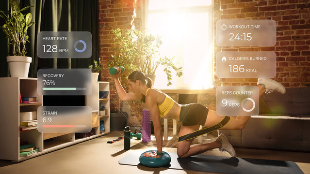 Woman combining dumbbell exercise and resistance training with digital workout metrics. Concept of adaptive coaching, wearable analytics, smart home fitness and quantified training.