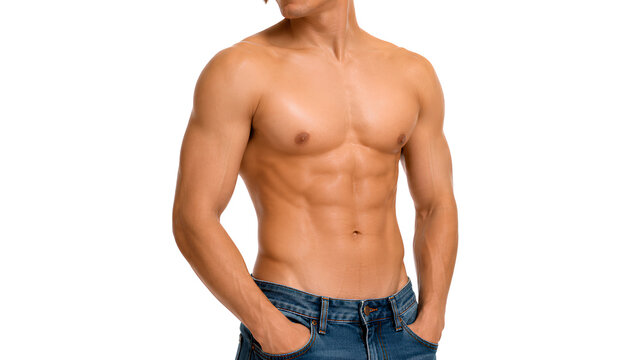 Confident Young Muscular Man Shirtless Showing Perfect Six Pack Abs and Toned Body Wearing Blue Jeans with Hands in Pockets