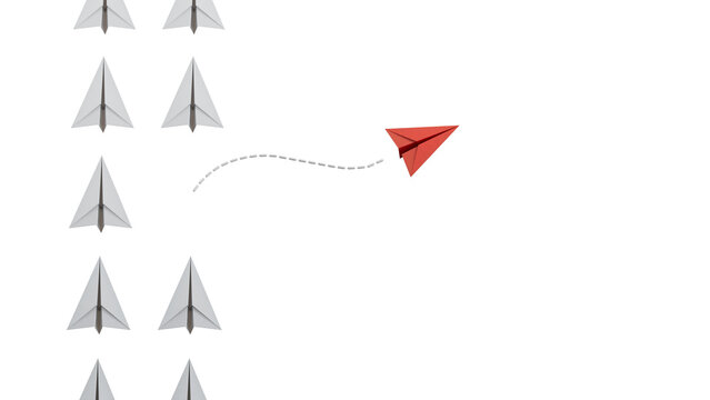 Top view of red paper paper plane origami leaving other white paper planes on blue background with customizable space for text or ideas. Leaderairplane skills concept.