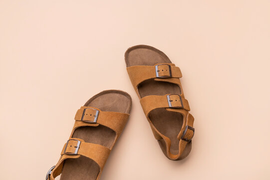 Stylish suede sandals in top view feature classic design and neutral tones. Sandals support fashion branding, online catalogs and lifestyle campaigns focused on quality and comfortable wear.
