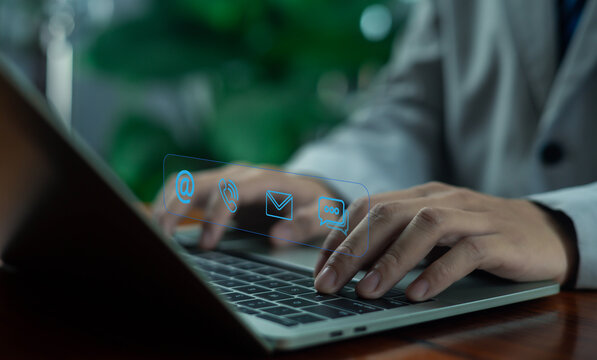 business professional typing on a laptop with a 24 service icon overlay, symbolizing continuous support, online availability, customer service accessibility, and nonstop digital operation in a modern.