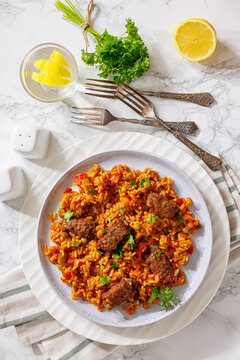 Greek Giouvetsi Rice Platter with Savory Biftekia