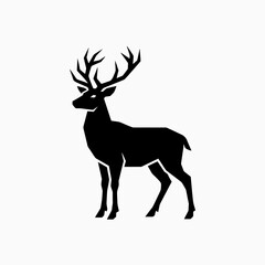 Fototapeta premium Black silhouette of a majestic stag standing on white.