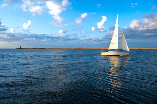 view on sailboat on Baltic sea during sunset in Poland