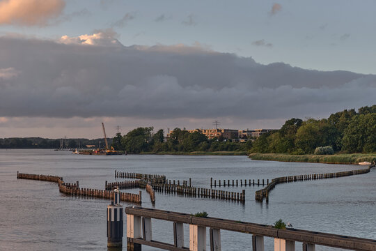 Traditional herring catch system on the Schlei in Kappeln Germany with historical fishing methods and coastal landscape wooden poles maritime