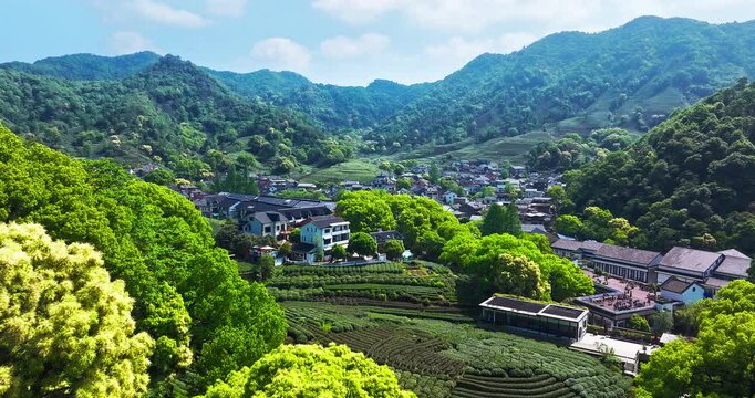Scenic aerial view of Longjing tea village nestled in the lush green mountains of Hangzhou, China.