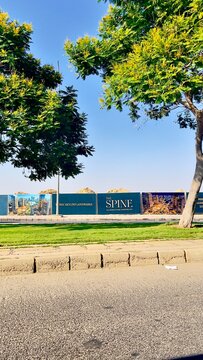 The Spine cognitive city development advertising billboard along roadside in Madinaty, Second New Cairo, Egypt, on July 15,2026 highlighting urban development and real estate marketing.