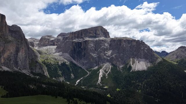 Sella Group Massif Aerial View Over Forested Alpine Valley, Towering Dolomite Cliffs South Tyrol Italy Dramatic Landscape
