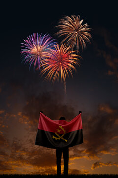 Girl with National flag of Angola on Independence day
