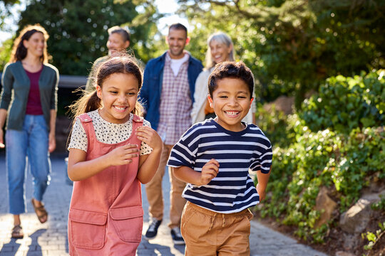 
Multiethnic children having fun while running with family