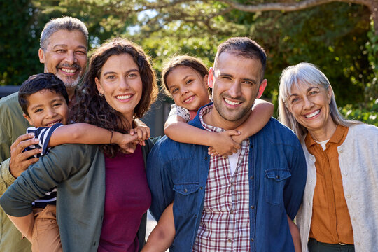 Portrait of multi generation family looking at camera