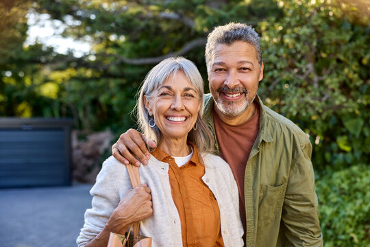 Senior healthy couple looking at camera during sunset outdoor