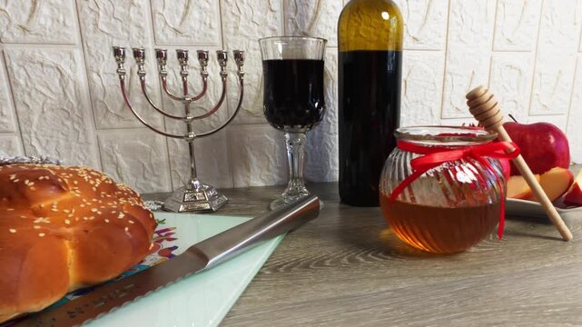 Rosh hashanah table with challah honey and wine