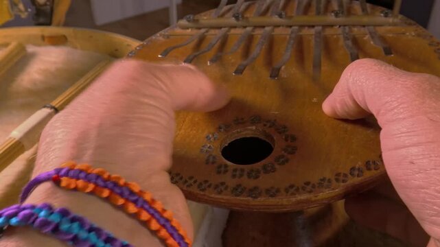Hands Playing Kalimba Thumb Piano Mid Shot, Wooden African Musical Instrument