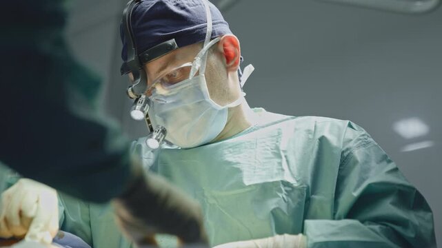 Two doctors surgeons in uniform mask physicians medics men operating communicating during operation. Caucasian man surgeon with medical nurse operate in aesthetic plastic surgery medicine in hospital