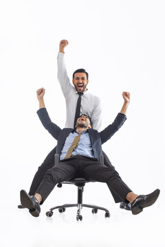 Corporate employee in formal clothing ecstatic as they celebrate their win together.