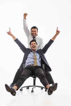 Corporate employee in formal clothing ecstatic as they celebrate their win together.