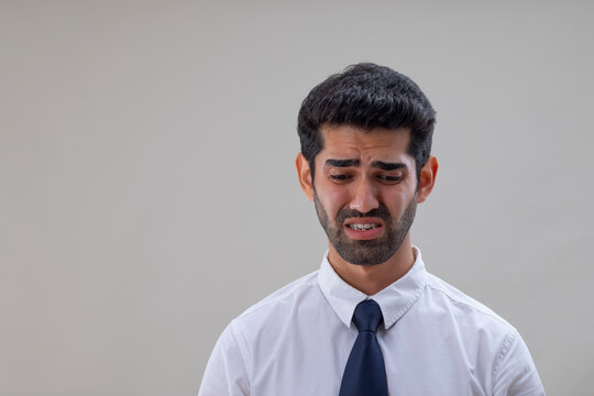 Portrait of a sad young man looking down