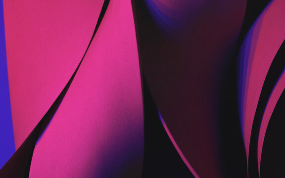 Wavy shapes illuminated by pink light, studio shot photo