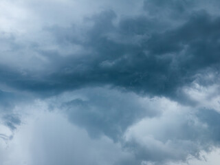 Dramatic Dark Blue Stormy Sky with Heavy Clouds Before Rain, Moody Monsoon Weather © Tavan