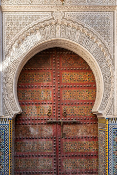Ornate Carved Red Door at the Mausoleum of Sidi Ahmed Tijani, Fes, Morocco