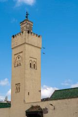 Obraz premium Minaret with Green Tile and Brick Detail at the Mosque Abi al Jonoud, Fes, Morocco