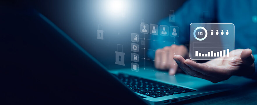 Business hand presenting a secure customer analytics dashboard with audience metrics, user segmentation, engagement insights and privacy protection on a virtual interface.
