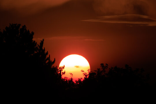 Ominous Red Sun Over Horizon