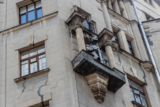 Historic knight statue on a balcony of the House with Knights on Arbat street
