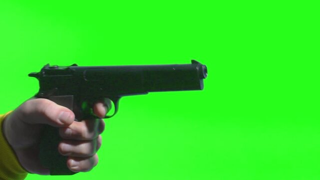 Close up of gunshot action on chromakey background during shooting practice