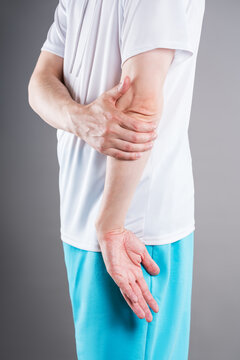 Diseases of the elbow joint, bone fracture and inflammation, man suffering from pain in cubit