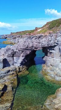 The famous natural arch Arco dei Baci, is Praneddas, Sant'Antioco, Sardinia, Italy

