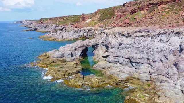 The famous natural arch Arco dei Baci, is Praneddas, Sant'Antioco, Sardinia, Italy

